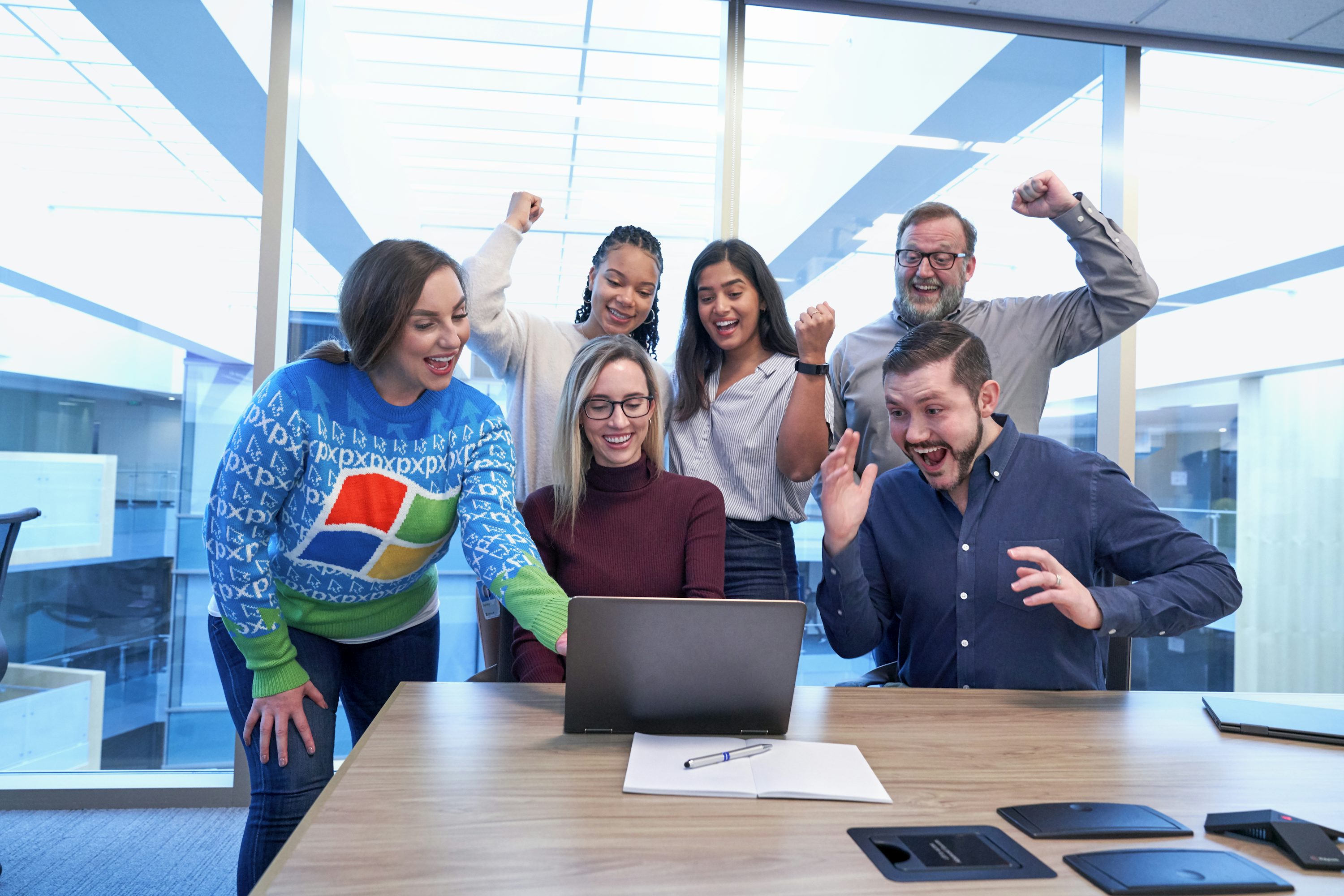 A happy and diverse business team celebrating success